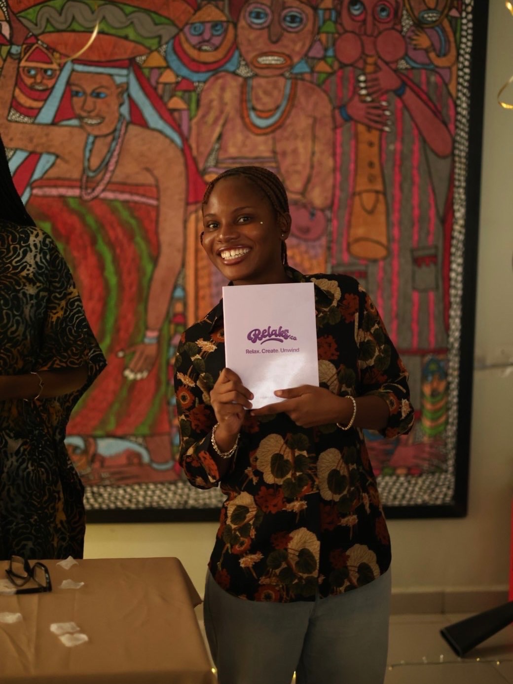 Guest presenting a Relaks Co. booklet at Glow Circle
